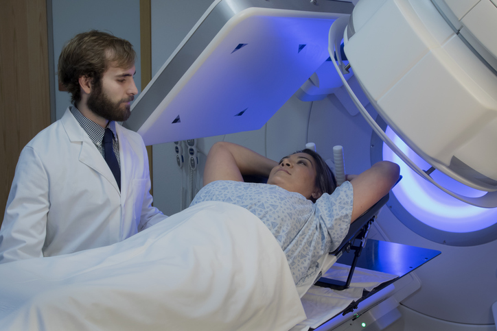 Photo shows a woman undergoing radiation therapy for breast cancer/Getty Images